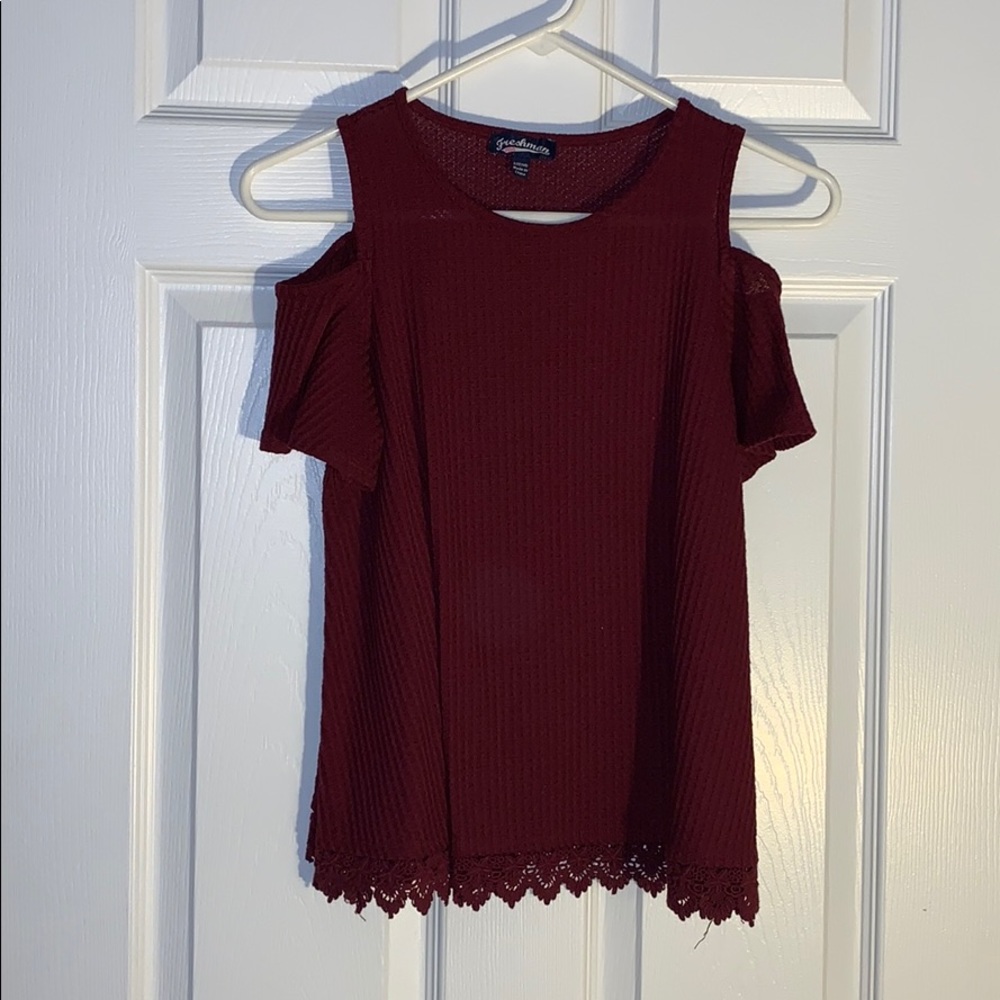 Burgundy red shirt with the shoulders cut out.